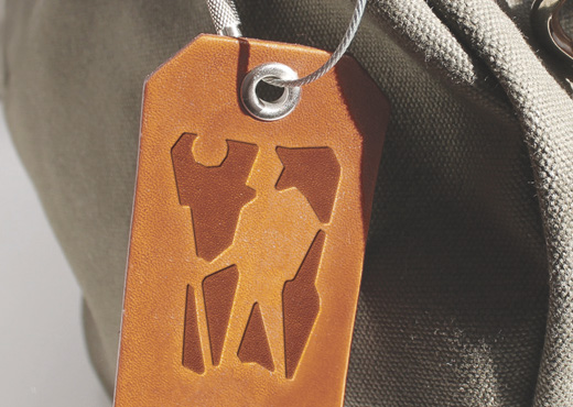 «Farland» Logo design for extreme tours agency on leather luggage tag